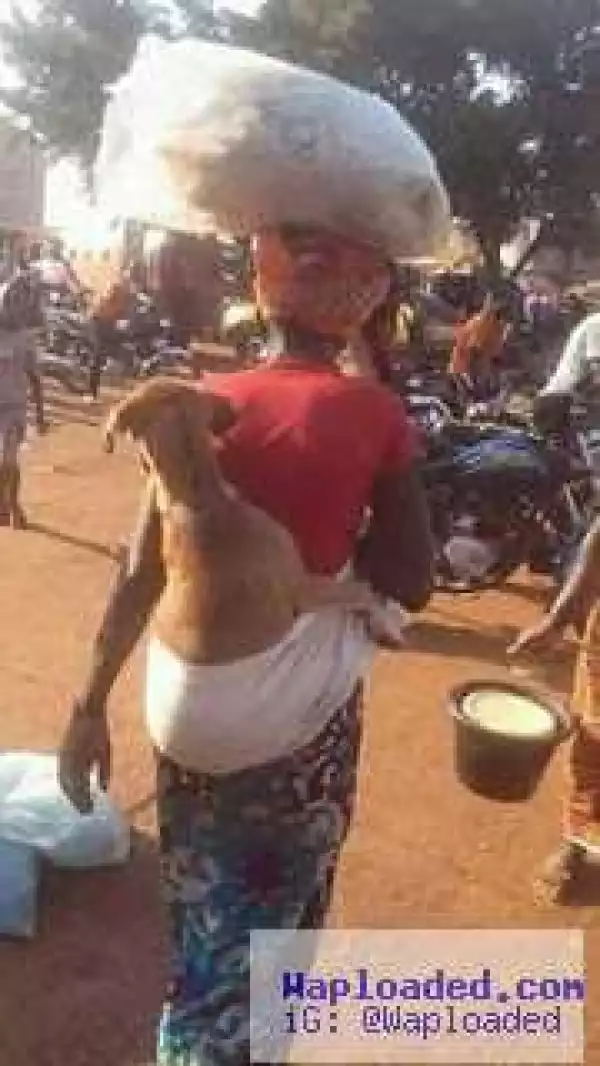 See What A Woman Was Spotted Carrying OnHer Back On The Road (Photo)